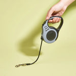 Retractable dog leash lock button and handle detail