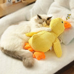 Comfort duck dog toy dog chewing calmly satisfied behavior