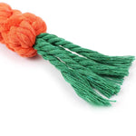 Carrot rope dog chew toy lifestyle dog happily chewing on toy