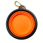 Collapsible dog travel bowl dog drinking from bowl outdoors