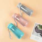 Travel dog water bottle with attached drinking bowl pink