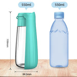 Dog travel water bottle being used outdoors on hiking trail