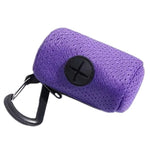 Dog poop bag dispenser lifestyle clipped to walking bag